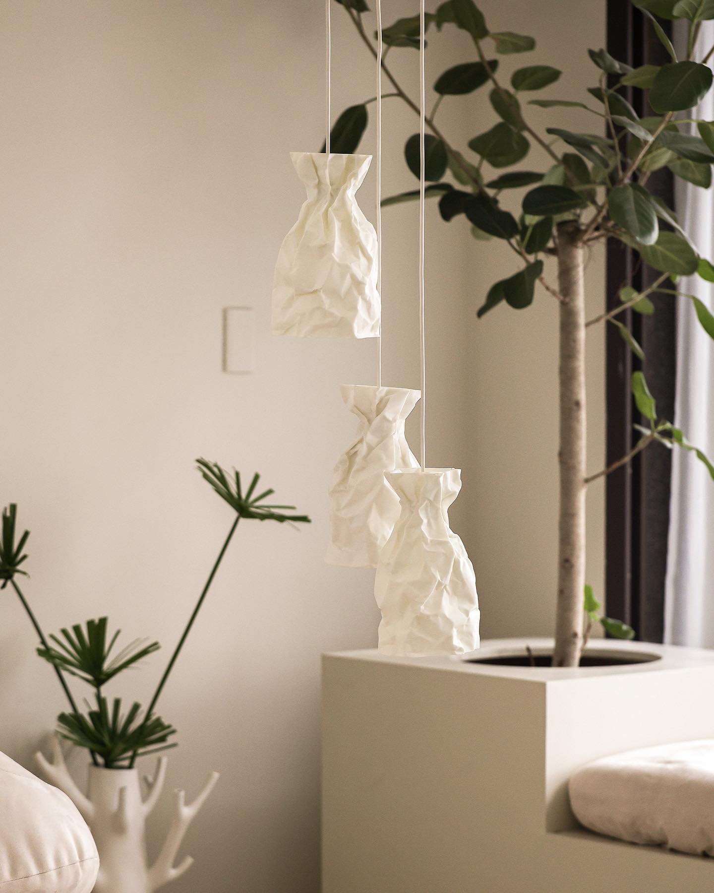 A Pendant Lamp of wrinkle & crinkle paper that echoes of shadow & balance