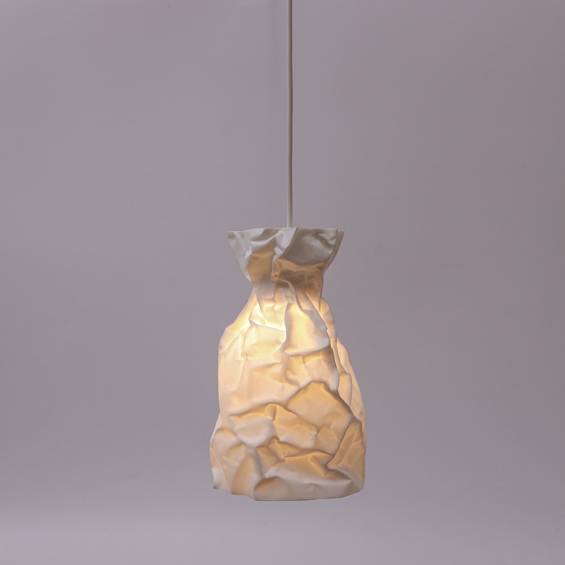 A Pendant Lamp of wrinkle & crinkle paper that echoes of shadow & balance