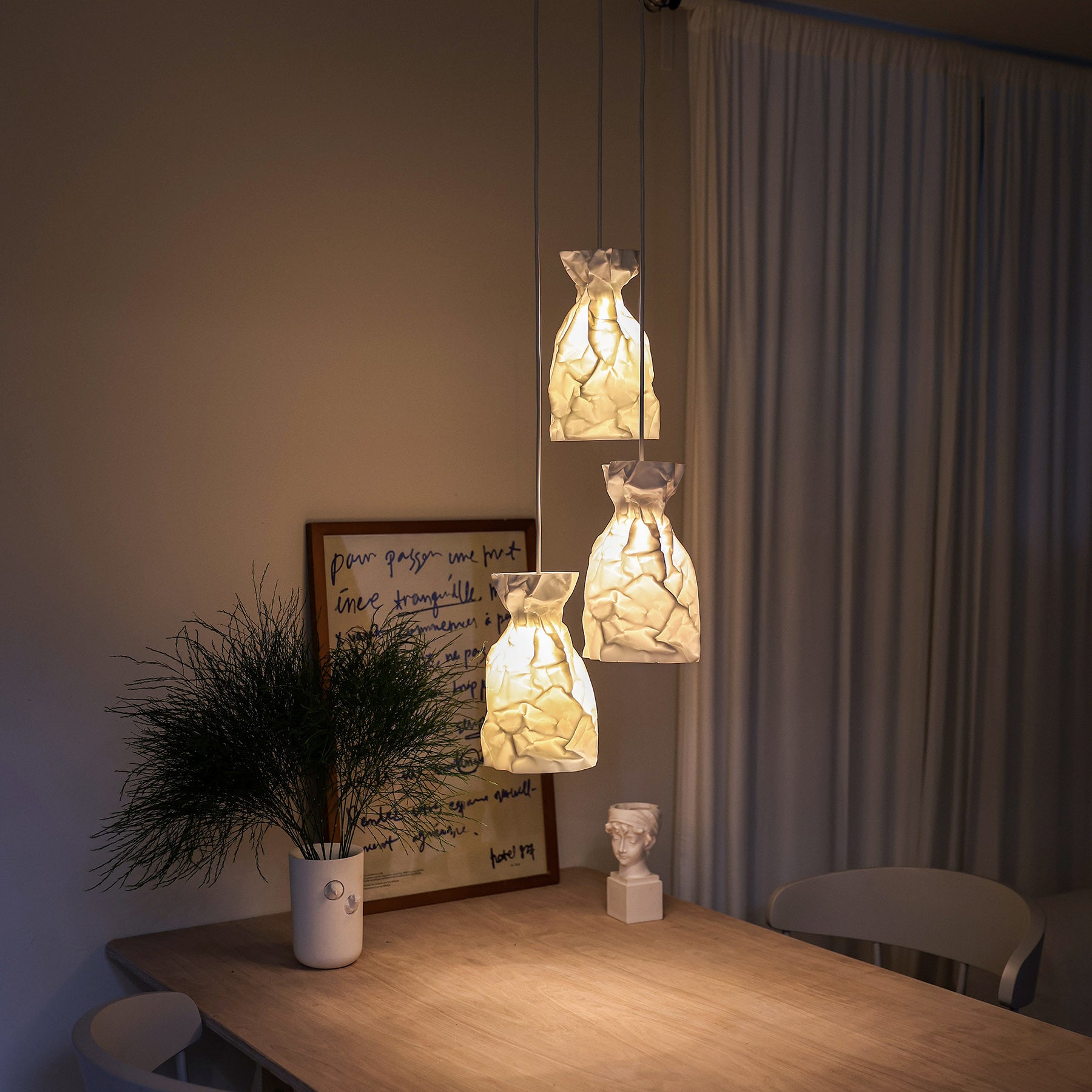 A Pendant Lamp of wrinkle & crinkle paper that echoes of shadow & balance