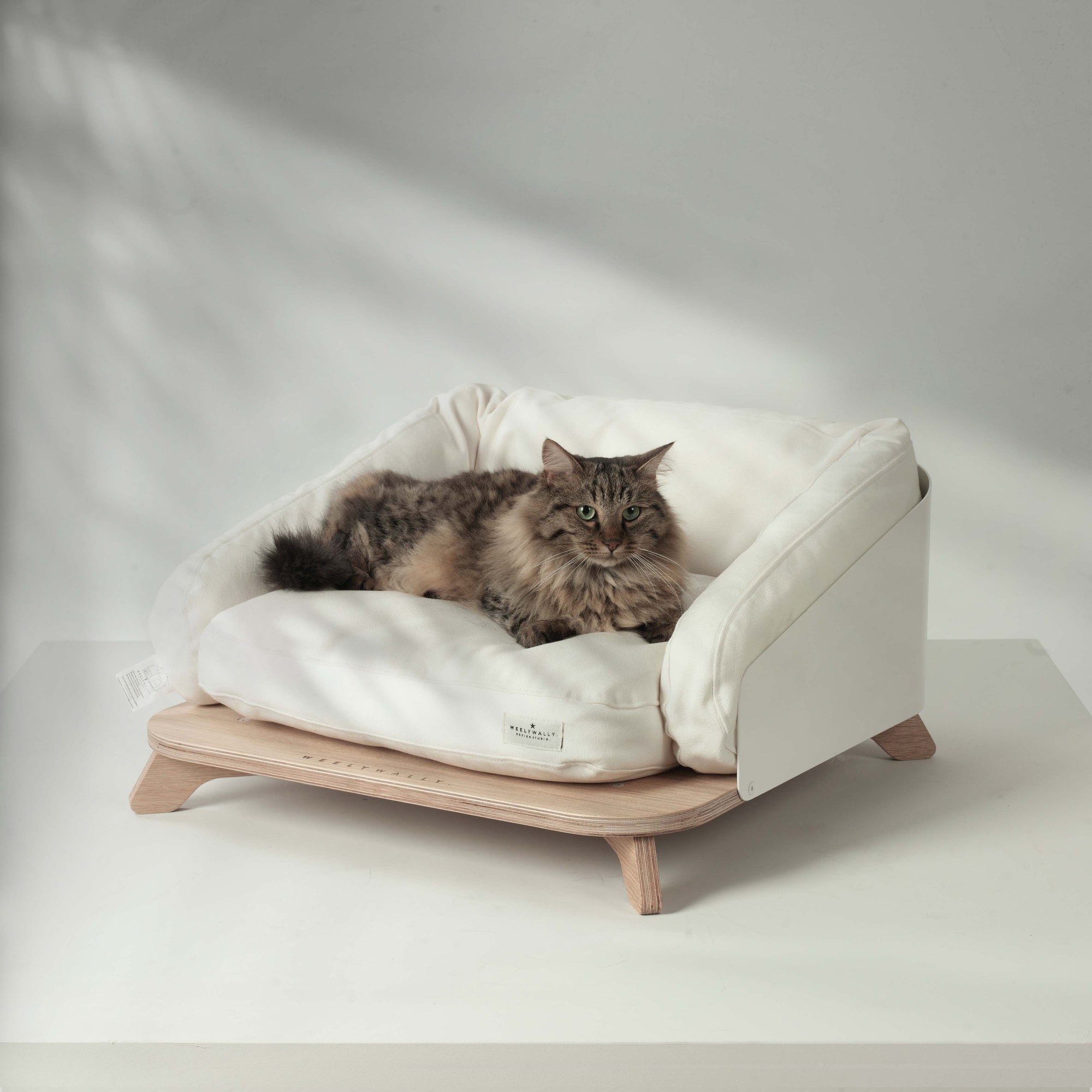 Elevated cat bed, sofa & couch, it puts your cat in the lap of napping!