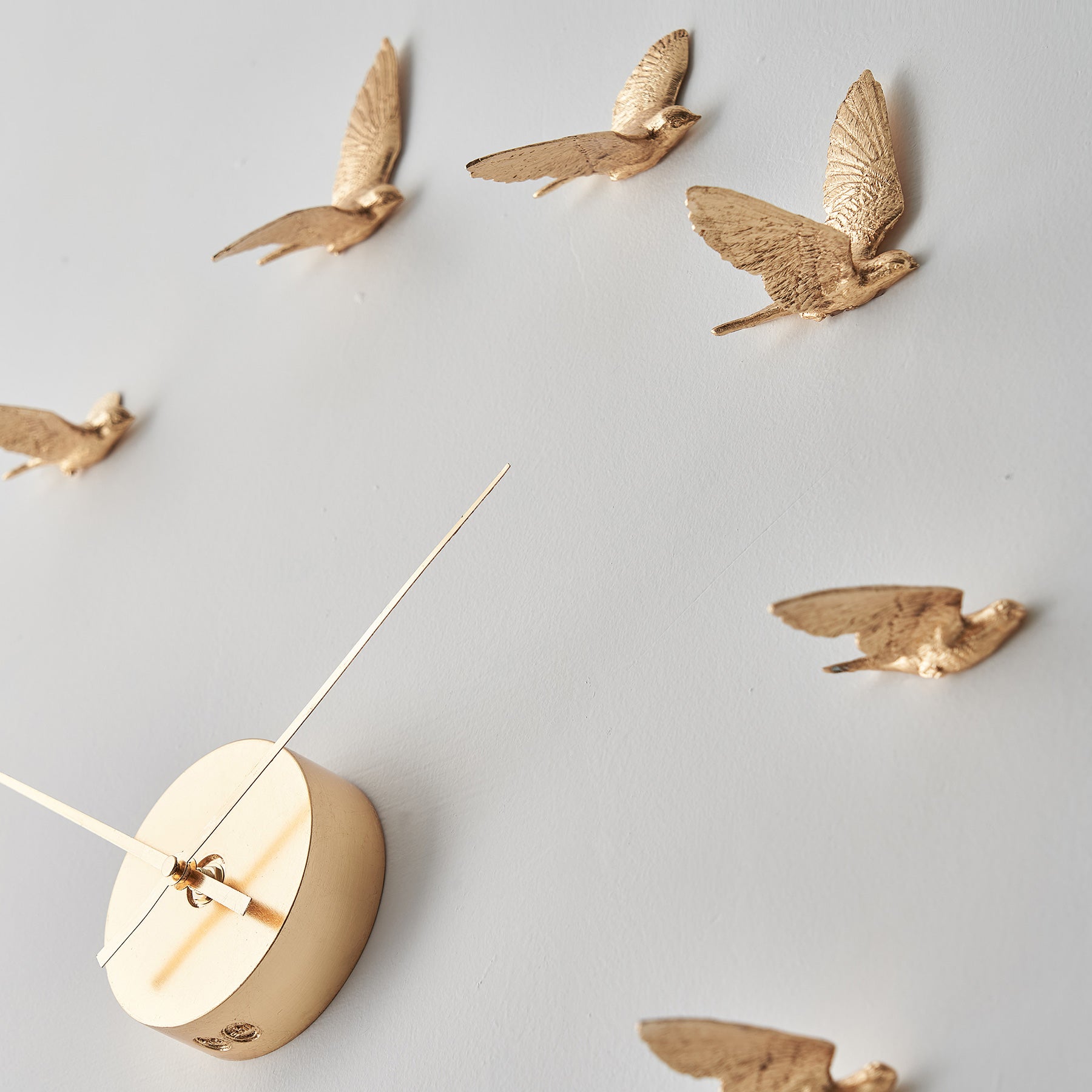 Contemporary and Modern Gold Wall Clock with Swallow Bird Sculpture