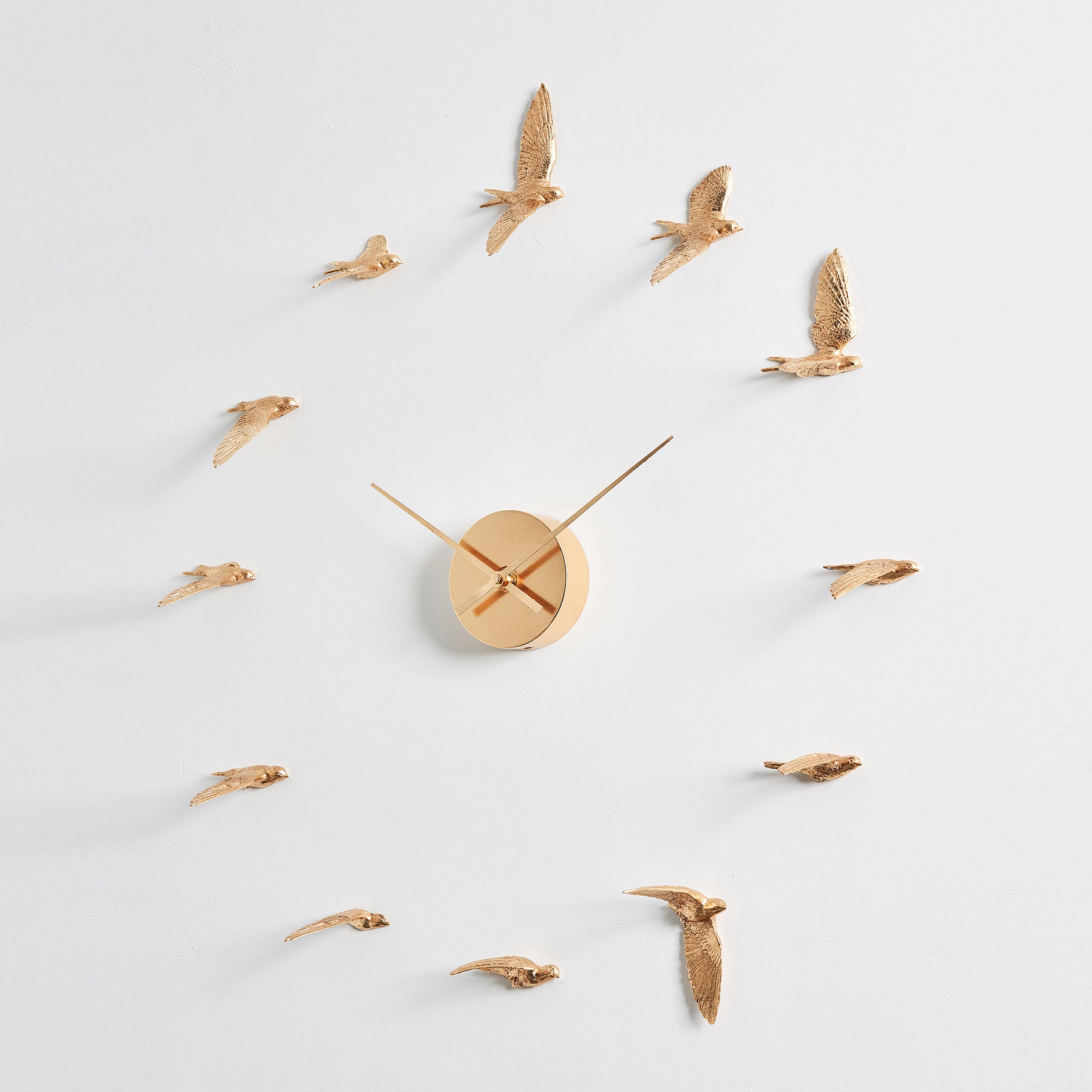 Contemporary and Modern Gold Wall Clock with Swallow Bird Sculpture