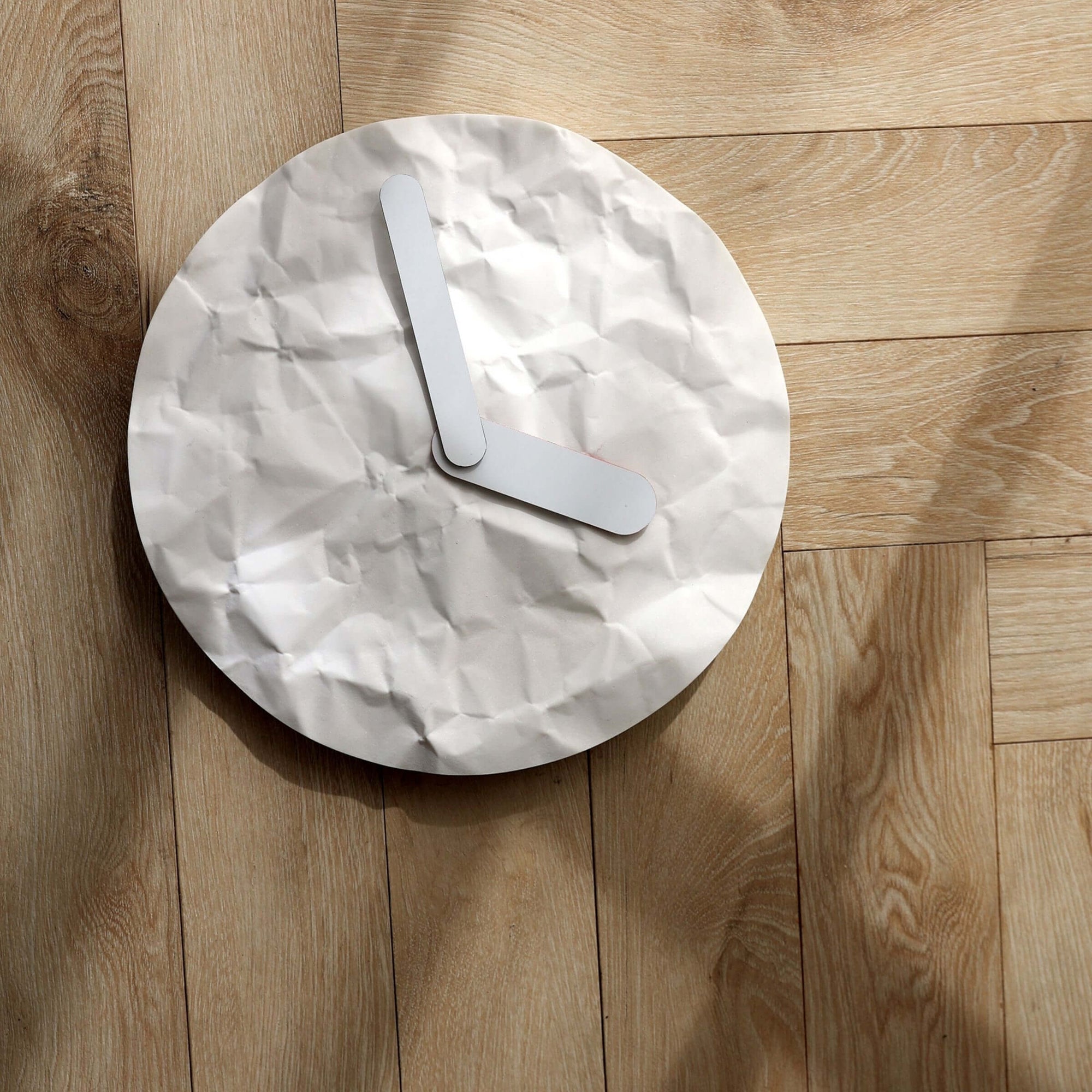 Modern wall clock - like just before or later, like a crumple paper