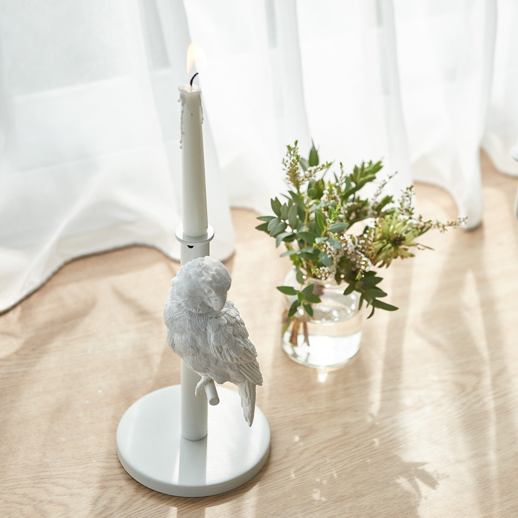 Get cozy with our parrot single candleholder in day and night