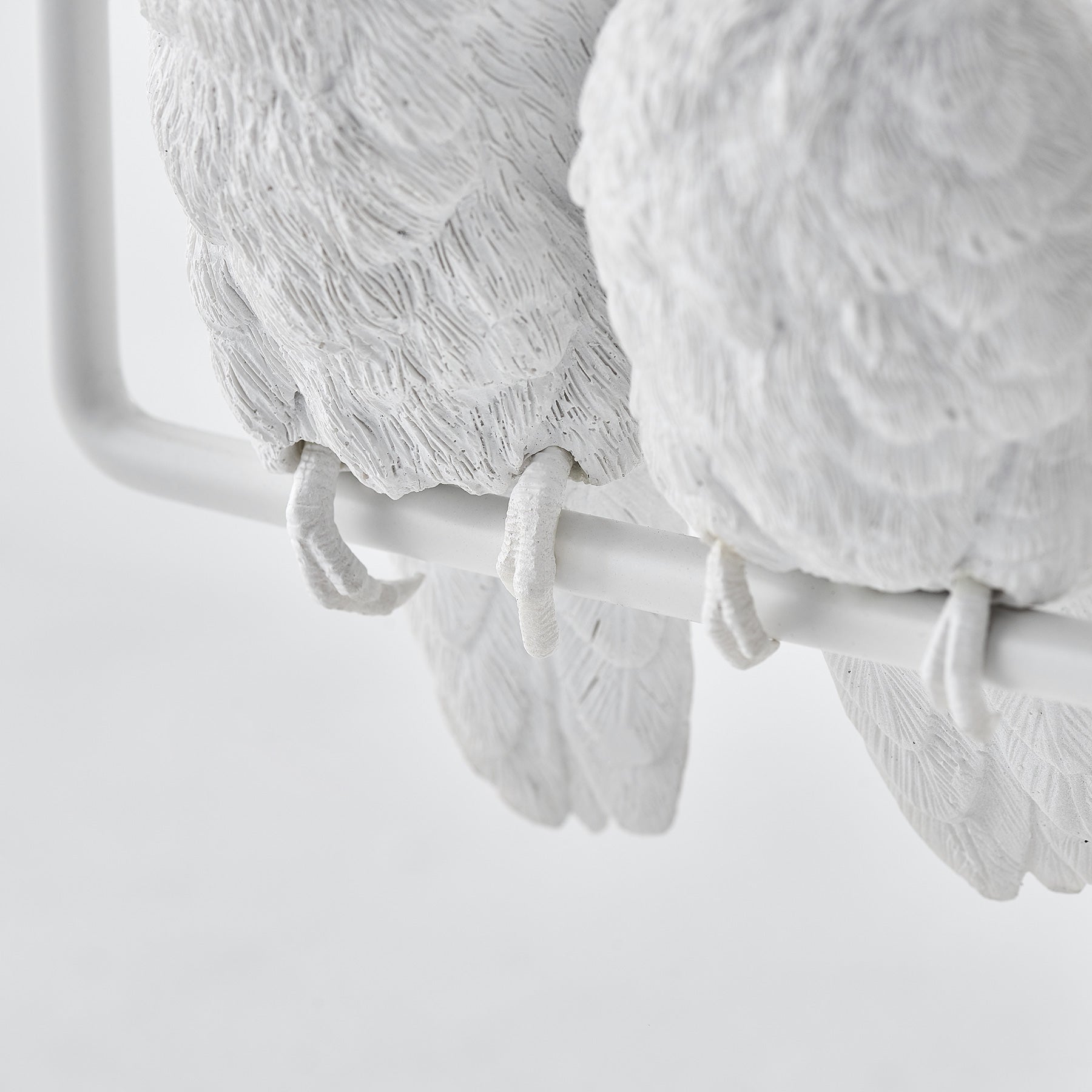 Three parrots create ambiance and good mood as candleholders