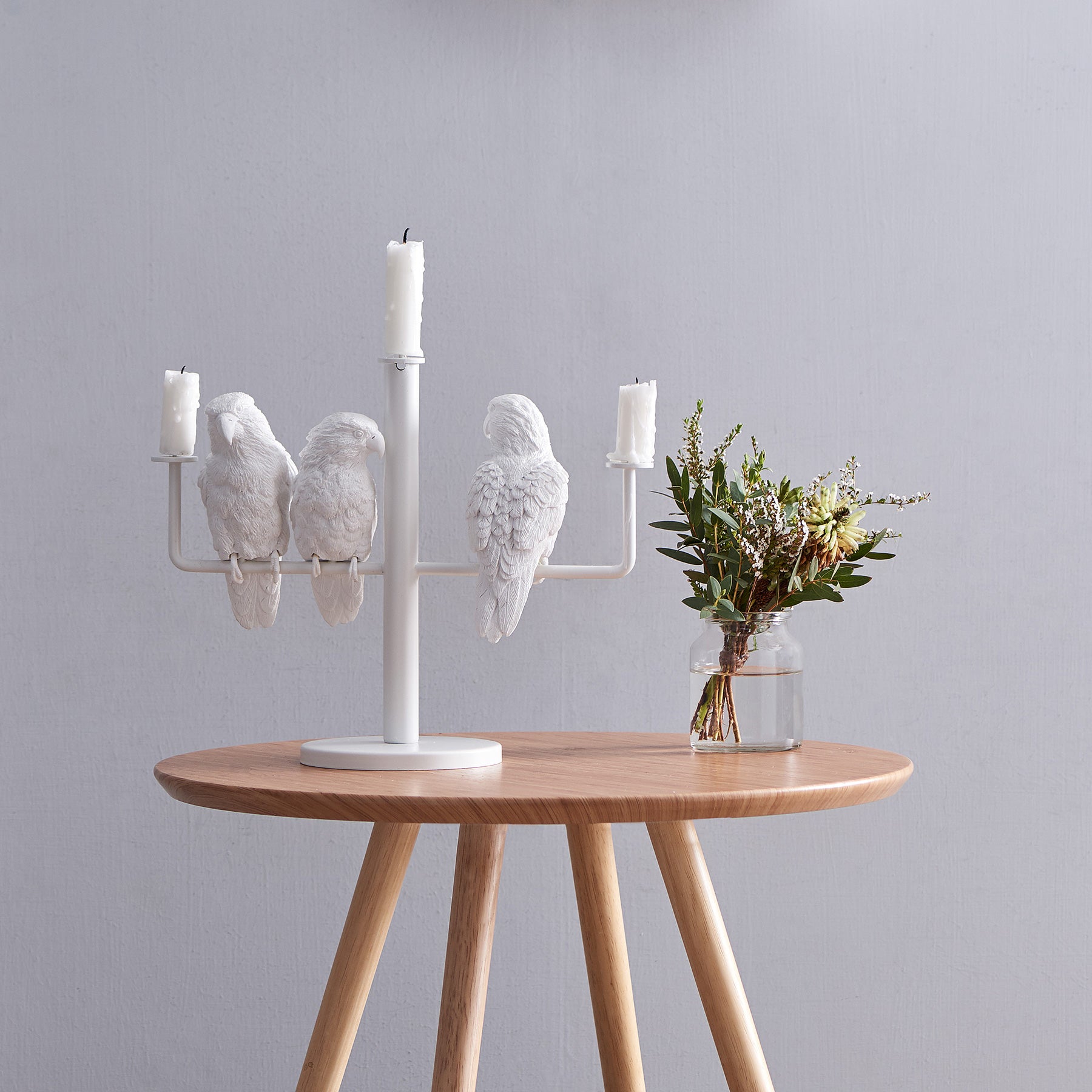 Three parrots create ambiance and good mood as candleholders