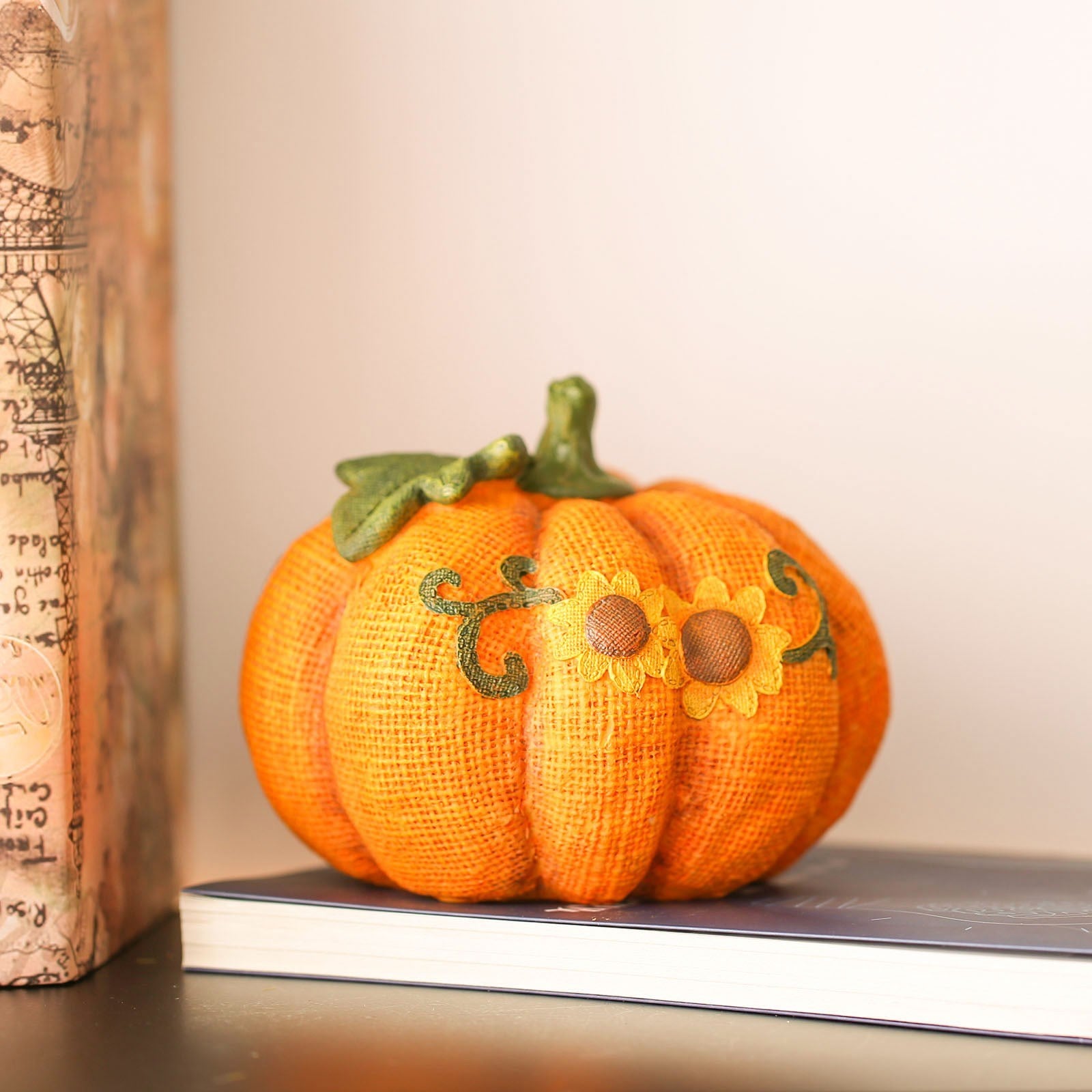 Give your home a warm and cozy feel with this festive pumpkin ornament
