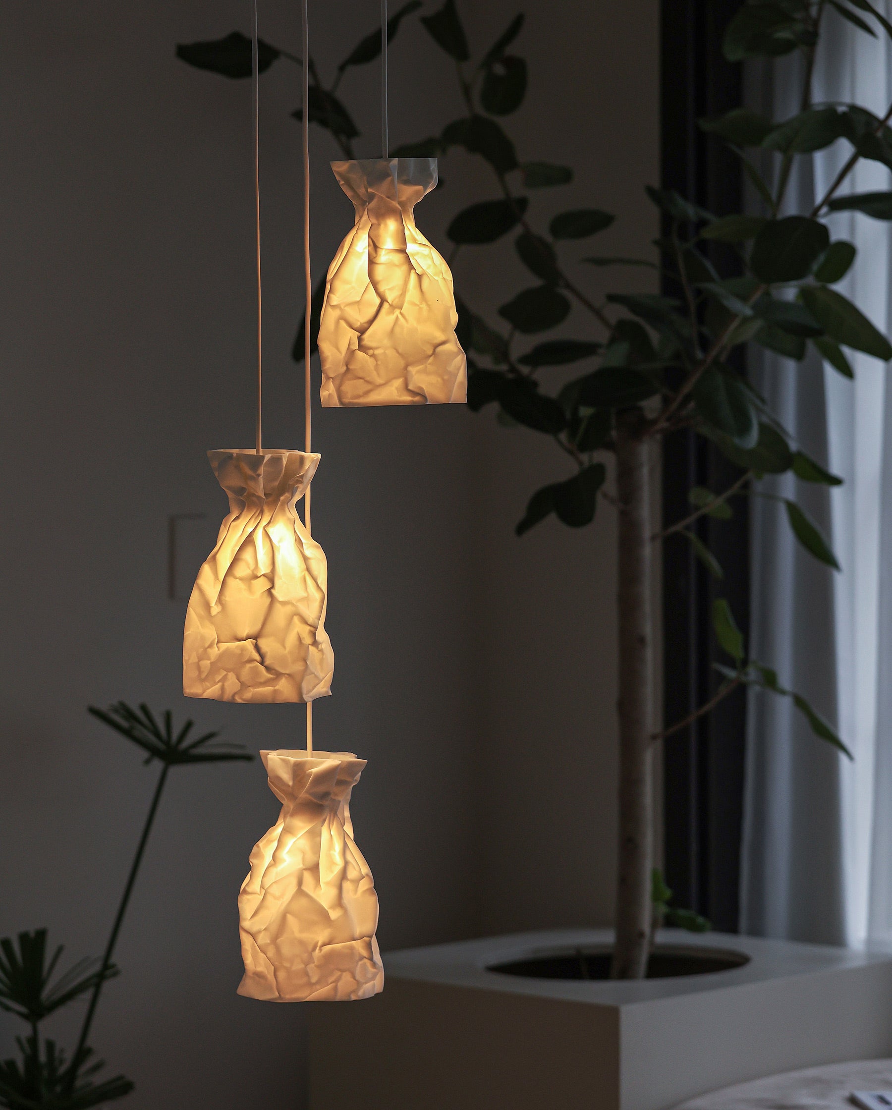 A Pendant Lamp of wrinkle & crinkle paper that echoes of shadow & balance