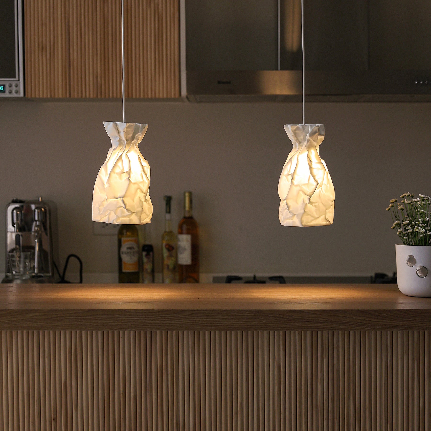 A Pendant Lamp of wrinkle & crinkle paper that echoes of shadow & balance