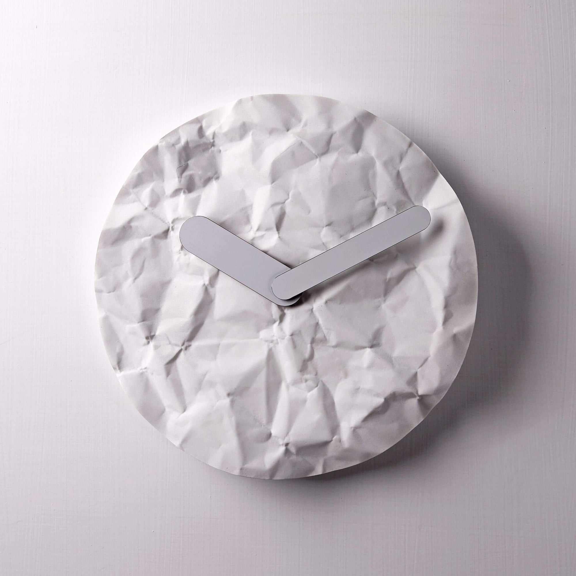 Modern wall clock - like just before or later, like a crumple paper