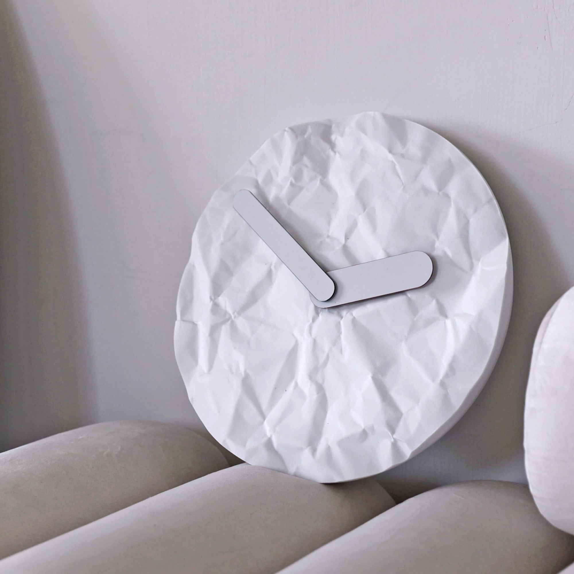 Modern wall clock - like just before or later, like a crumple paper